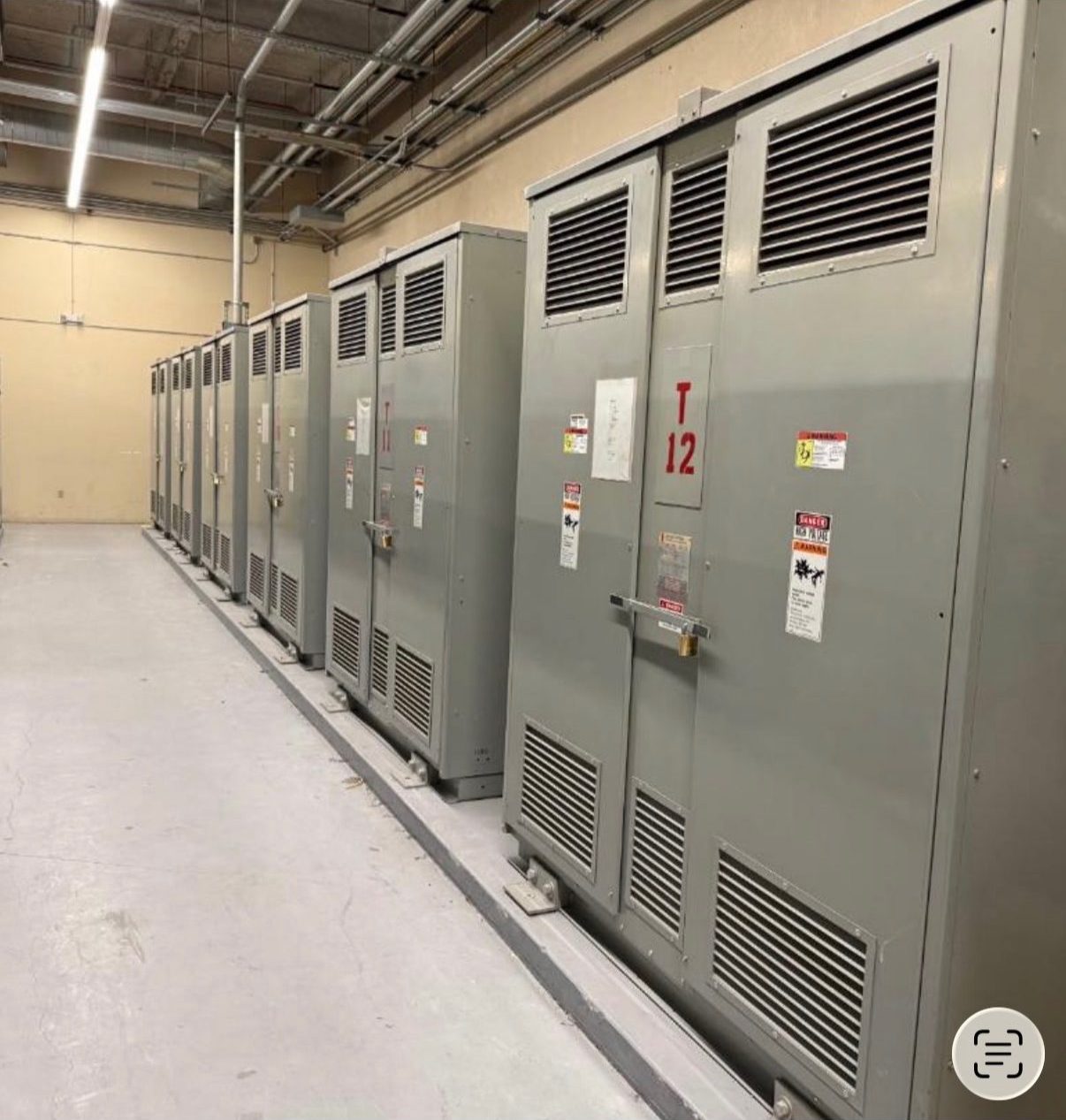 Row of dry-type transformers and switchboard sections we purchased during an electrical room demo